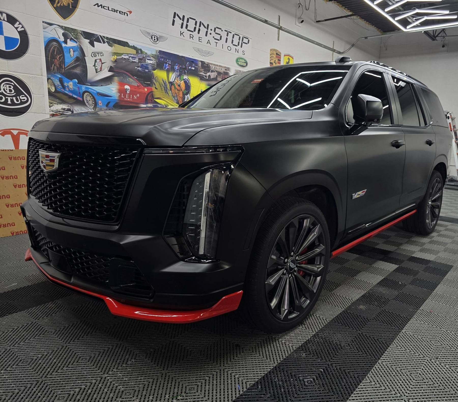 Cadillac Escalade · matte black + red accents